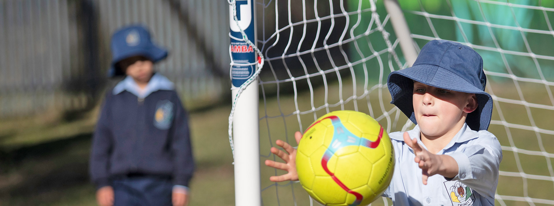 Trinity Catholic Primary Kemps Creek student catching ball