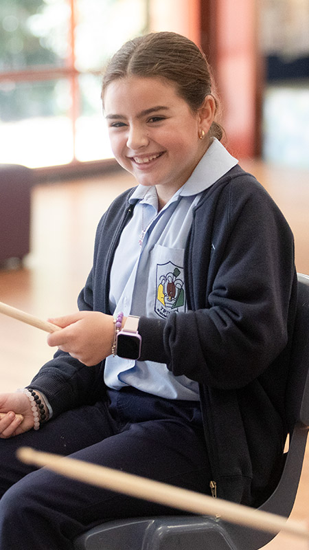 Students drumming at Trinity Catholic Primary Kemps Creek