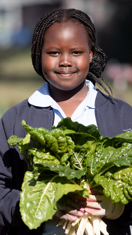 Trinity Catholic Primary Kemps Creek student gardening