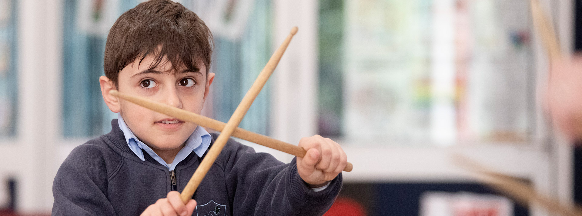 Trinity Catholic Primary Kemps Creek student playing drums