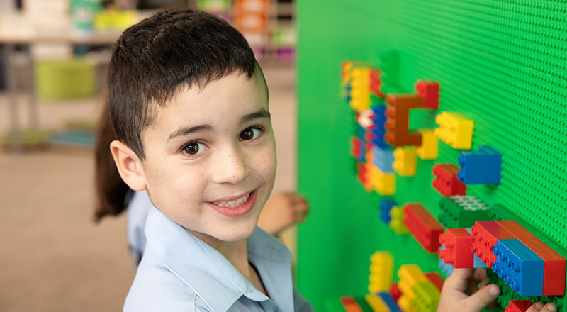 Trinity Catholic Primary Student playing with Lego