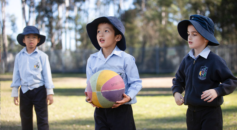 Trinity Catholic Primary School Kemps Creek students playing ball