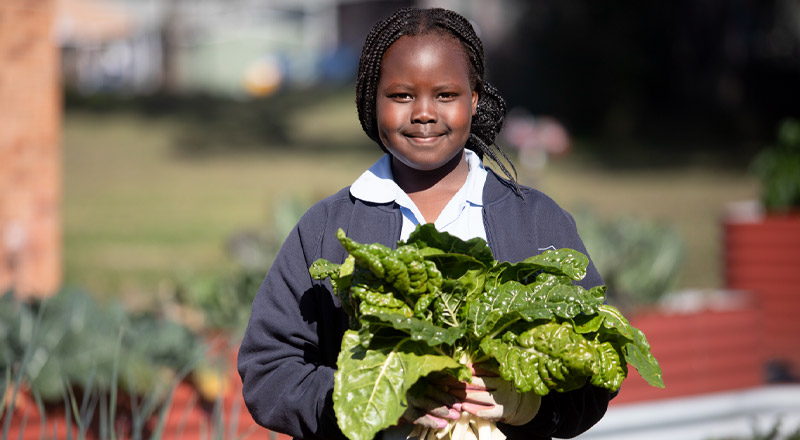 Trinity Catholic Primary Kemps Creek student gardening
